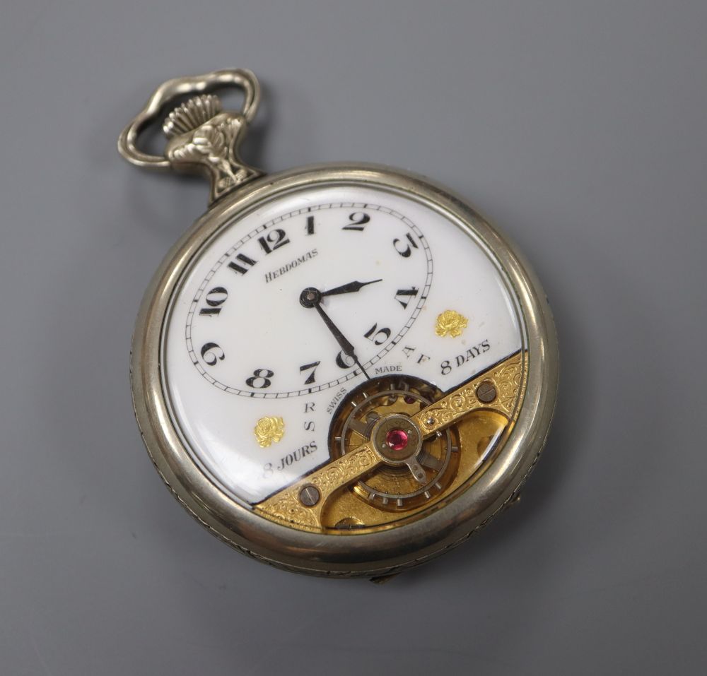 A mid 20th century base metal Hebdomas 8 Day pocket watch, the case back embossed with artist at work.